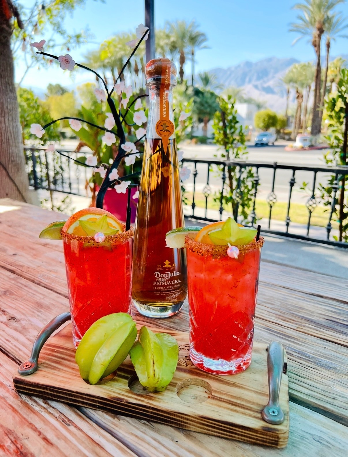 Two colorful Felipe’s margaritas served with starfruit